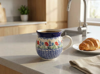 memory garden bubble mug filled with coffee by kitchen sink and pastry