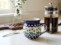 Polish pottery Alyce bubble mug on kitchen counter with coffee french press and coffee beans