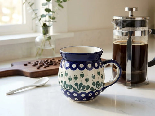 Polish pottery Alyce bubble mug on kitchen counter with coffee french press and coffee beans