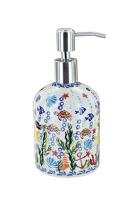 Product shot of Polish pottery soap dispenser with ocean theme 