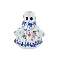 A ceramic ghost figurine with a white glaze, decorated with blue floral borders and small multicolored berries, on a solid white background.