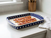 Polish pottery dots bacon cooker on kitchen counter with crispy bacon