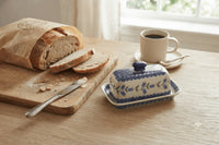 tulip butter dish with fresh bakery bread and coffee mug