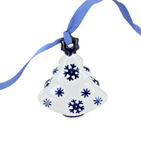 A white ceramic Christmas tree ornament decorated with blue snowflakes and a blue hanging ribbon, shown against a plain white background.
