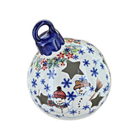 A ceramic Christmas ornament shaped like a bauble with a blue loop handle, decorated with blue snowflakes, red berries, holly, and two snowmen on a white background.