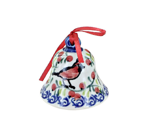 A hand-painted ceramic Christmas bell ornament with a red bird, red berries, green leaves, and a blue floral border, hanging from a red ribbon on a white background.